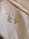 Butterfly charm earrings